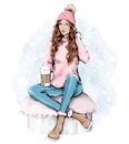 Beautiful young woman in warm knitted hat. Trendy casual fashion winter outfit. Pretty woman holding paper coffee cup. Winter look Royalty Free Stock Photo