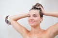 Beautiful young woman washing hair Royalty Free Stock Photo