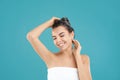 Beautiful young woman washing hair on blue background Royalty Free Stock Photo