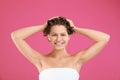 Beautiful young woman washing hair on pink Royalty Free Stock Photo