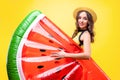 Beautiful young woman with watermelon inflatable floating mattress. Royalty Free Stock Photo