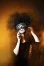 Beautiful young woman wearing carnival mask with feathers Royalty Free Stock Photo