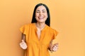 Beautiful young woman wearing casual clothes excited for success with arms raised and eyes closed celebrating victory smiling Royalty Free Stock Photo