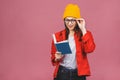 Beautiful young woman wearing casual and eyeglasses standing isolated over pink background, reading a book Royalty Free Stock Photo