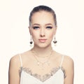 Beautiful young woman wearing fashion golden chain earrings and necklace with white pearls portrait Royalty Free Stock Photo