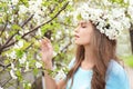 Beautiful young woman wearing flower wreath outdoors on spring day Royalty Free Stock Photo