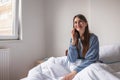 Woman having phone conversation in bed Royalty Free Stock Photo