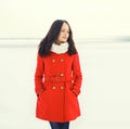 Beautiful young woman wearing a red coat Royalty Free Stock Photo