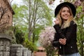 Beautiful young woman wearing stylish hat on spring day, space for text Royalty Free Stock Photo