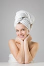 Beautiful young woman wearing white towel on her head