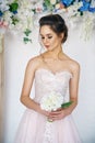 Beautiful young woman in wedding dress, romantic image of the bride, beautiful make-up and hairstyle