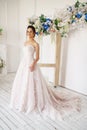 Beautiful young woman in wedding dress, romantic image of the bride, beautiful make-up and hairstyle