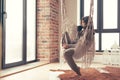 Woman wearing cashmere nightwear relaxing in cabin