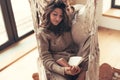 Woman wearing cashmere nightwear relaxing in cabin Royalty Free Stock Photo