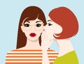 Beautiful young woman whispering secrets to her surprised female friend Royalty Free Stock Photo