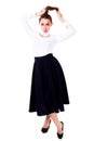 Beautiful young woman in a white blouse and a long black skirt Royalty Free Stock Photo