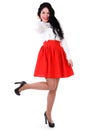 Beautiful young woman in a white blouse and a red skirt Royalty Free Stock Photo