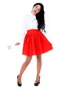 Beautiful young woman in a white blouse and a red skirt Royalty Free Stock Photo