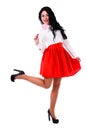 Beautiful young woman in a white blouse and a short red skirt Royalty Free Stock Photo