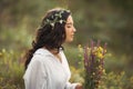 Natural beauty girl with bouquet of flowers outdoor in freedom enjoyment concept. Portrait photo Royalty Free Stock Photo