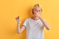 Beautiful young woman in white t-shirt closing her nose with fingers Royalty Free Stock Photo