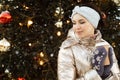 Beautiful young woman in winter clothes at christmas market drinking coffee Royalty Free Stock Photo
