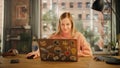 Beautiful Young Woman Working on Laptop Computer while Sitting in Stylish Cozy Creative Office Royalty Free Stock Photo