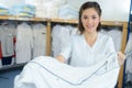 Beautiful young woman working at laundry Royalty Free Stock Photo