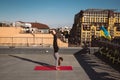 Young woman working out outdoors and doing yoga handstand exercise Royalty Free Stock Photo