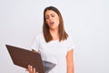 Beautiful young woman working using computer laptop over white background looking sleepy and tired, exhausted for fatigue and Royalty Free Stock Photo