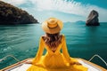 beautiful young woman in yellow dress sit in a boat luxury summer vacation Royalty Free Stock Photo