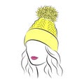 Beautiful young woman in yellow knitted hat with pompom Royalty Free Stock Photo