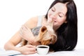 Beautiful young woman with Yorkshire Terrier drinking morning coffee Royalty Free Stock Photo