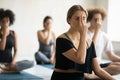 Woman doing Alternate Nostril Breathing exercise close up, practicing yoga Royalty Free Stock Photo