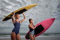 Beautiful young women surfer Royalty Free Stock Photo