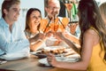 Beautiful woman toasting with her boyfriend and her best friends