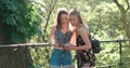 Beautiful young women watching photos on a phone.