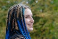 Beautiful young womenl with african blue braids. A laughing woma Royalty Free Stock Photo