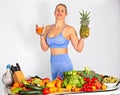 European lovely fitness Caucasian woman with heap Of vegetables. Isolated.