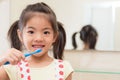 Beautiful youth kid daughter holding toothbrush