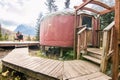 Forest Yurt Against Trees and Mountain Backdrop