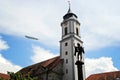 Beautiful Zeppelin Flying Above the Curch in Lindau, Bodensee in Royalty Free Stock Photo