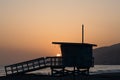 Beautiful Zuma Beach sunset with the lifeguard station n the foreground, Malibu, California Royalty Free Stock Photo