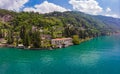 Beautifull aerial panoramic view from the drone to Varenna famous old Italy town on bank of Como lake. High top view to Royalty Free Stock Photo