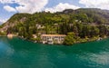 Beautifull aerial panoramic view from the drone to Varenna famous old Italy town on bank of Como lake. High top view to villa Royalty Free Stock Photo