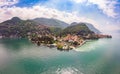 Beautifull aerial panoramic view from the drone to the Varenna - famous old Italy town on bank of Como lake. High top Royalty Free Stock Photo