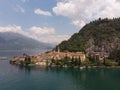 Beautifull aerial panoramic view from the drone to the Varenna - famous old Italy town on bank of Como lake. High top view to Royalty Free Stock Photo