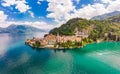 Beautifull aerial panoramic view from the drone to the Varenna - famous old Italy town on bank of Como lake. High top Royalty Free Stock Photo