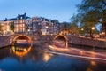 Beautifull Amsterdam canals with bridge and typical dutch houses Royalty Free Stock Photo