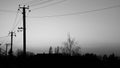 Beautifull black summer sunset sunset against the background village , building , trees and electricity power lines Royalty Free Stock Photo